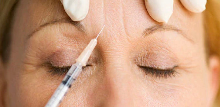 woman in mirror botox