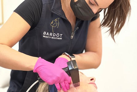 Morpheus8 radiofrequency microneedling treatment being performed on the face