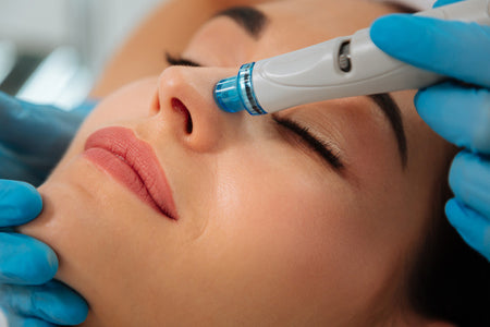 Hydrafacial treatment to cleanse, exfoliate, and hydrate the skin.